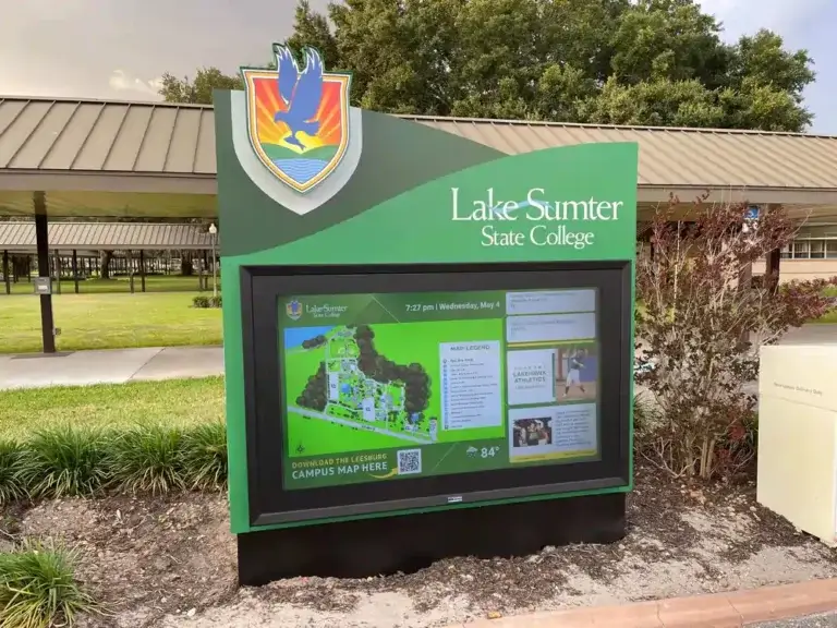 Lake-Sumter State College outdoor digital signage from Reach Media Network displaying campus wayfinding map, upcoming events, social media, and QR codes to maps