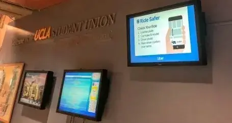 University of California, Los Angeles digital signage screen featured in student union and displaying important announcements, Reach Media Network