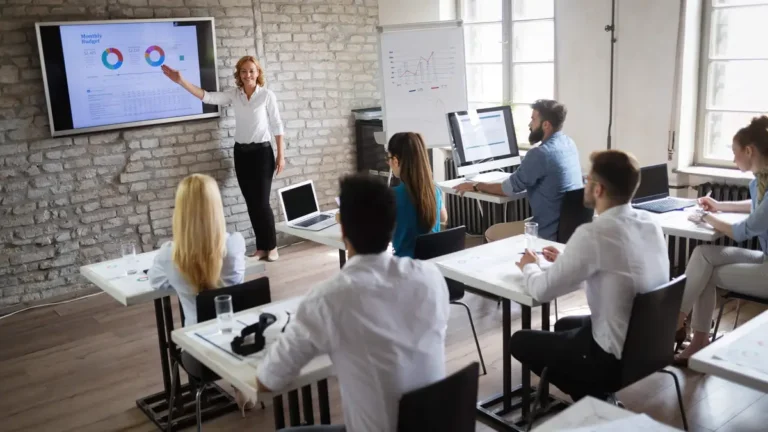 education digital signage example from Reach Media Network displaying infographics and corporate metrics