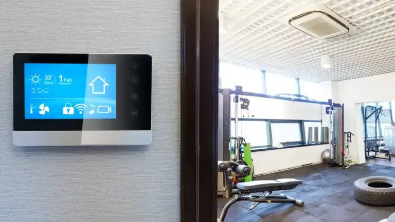 fitness digital signage featured by gym entrance, Reach Media Network, 2026