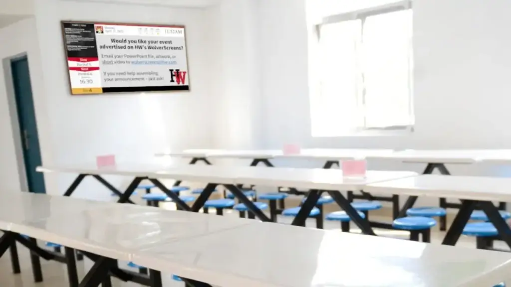 High school digital signage by Reach Media Network featured in student cafeteria.